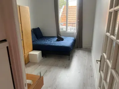 Un ou plusieurs lits dans un hébergement de l'établissement Appartement calme au cœur du 20 eme arrondissement