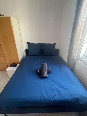 Un ou plusieurs lits dans un hébergement de l'établissement Appartement calme au cœur du 20 eme arrondissement