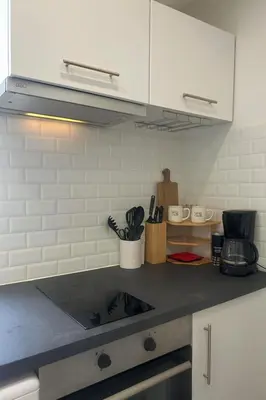Cuisine ou kitchenette dans l'établissement NEW Cosy in Paris