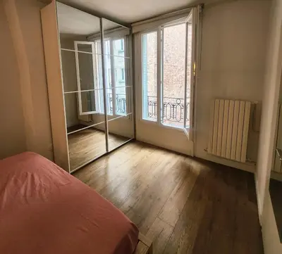 Un ou plusieurs lits dans un hébergement de l'établissement NEW Cosy in Paris