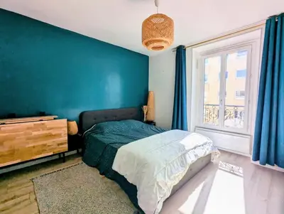 Un ou plusieurs lits dans un hébergement de l'établissement Cosy et confortable appartement 4 personnes