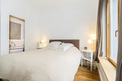 Un ou plusieurs lits dans un hébergement de l'établissement Quiet family apartment on private garden 7pers - Paris Rolland Garros