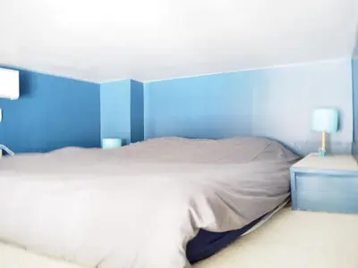 Un ou plusieurs lits dans un hébergement de l'établissement Quiet family apartment on private garden 7pers - Paris Rolland Garros