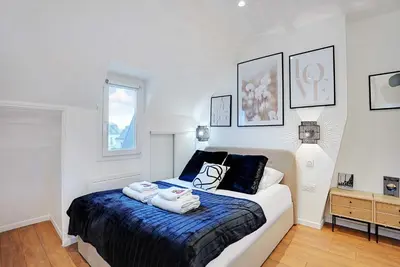 Un ou plusieurs lits dans un hébergement de l'établissement Apartment Cosy - 1BDR-2P - Concorde