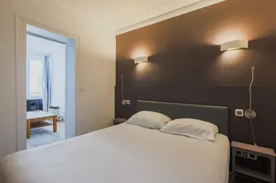 Un ou plusieurs lits dans un hébergement de l'établissement Cosy Apartment 1BR-2P-Montmartre-Sacre