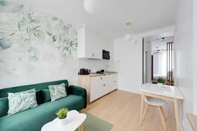 Cuisine ou kitchenette dans l'établissement Bright Apartment 1BR-2P - Parc de la Villette