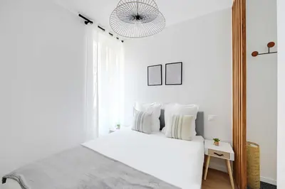 Un ou plusieurs lits dans un hébergement de l'établissement Bright Apartment 1BR-2P - Parc de la Villette