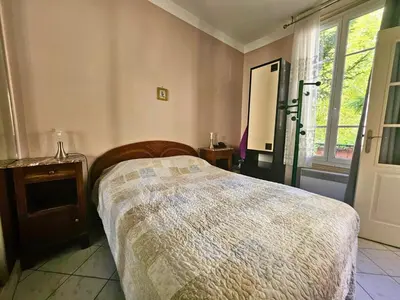 Un ou plusieurs lits dans un hébergement de l'établissement Le Jardin Edgar Malakoff