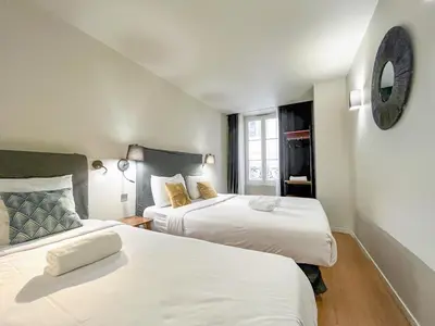 Un ou plusieurs lits dans un hébergement de l'établissement UrbanFlat 131 - Amazing apartment in the center of Paris