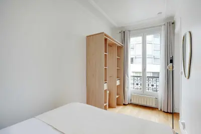Un ou plusieurs lits dans un hébergement de l'établissement Parisian charm -1BR-3P - Paris 15