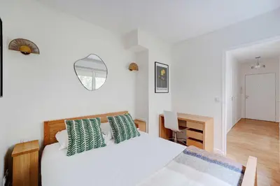 Un ou plusieurs lits dans un hébergement de l'établissement Apt Cosy - AC-1CH-4P - Suresnes-Parc du Chateau