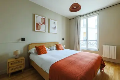 Un ou plusieurs lits dans un hébergement de l'établissement Elegant Appt - 2BDR-4P - Bastille - Marais