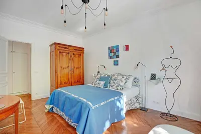Un ou plusieurs lits dans un hébergement de l'établissement Elegant apartment - 4BR -10P- Madeleine