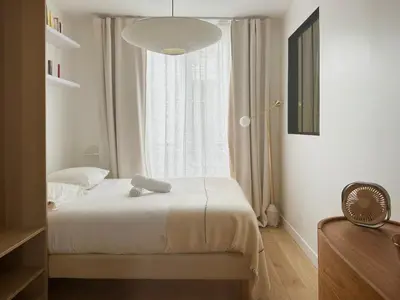 Un ou plusieurs lits dans un hébergement de l'établissement LE GAST - L'élégance au coeur de Paris