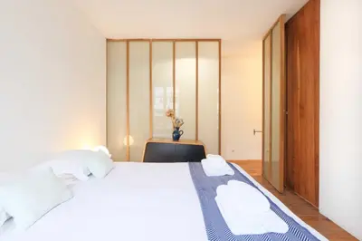 Un ou plusieurs lits dans un hébergement de l'établissement Charming Duplex - 2BD-5P - Nation