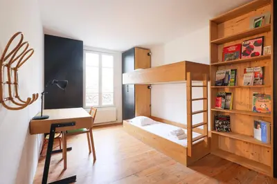Un ou plusieurs lits dans un hébergement de l'établissement Charming Duplex - 2BD-5P - Nation