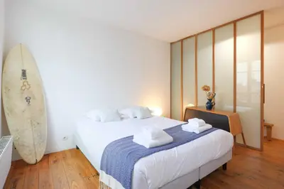 Un ou plusieurs lits dans un hébergement de l'établissement Charming Duplex - 2BD-5P - Nation