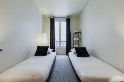 Un ou plusieurs lits dans un hébergement de l'établissement Charming apartment - 2BR-6P - Petit-Montrouge