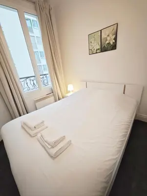 Un ou plusieurs lits dans un hébergement de l'établissement Beaugrenelle 1-Min Walk Elegant 2P Flat
