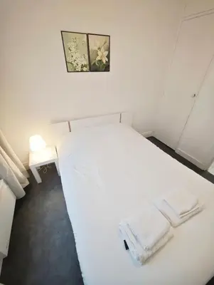 Un ou plusieurs lits dans un hébergement de l'établissement Beaugrenelle 1-Min Walk Elegant 2P Flat