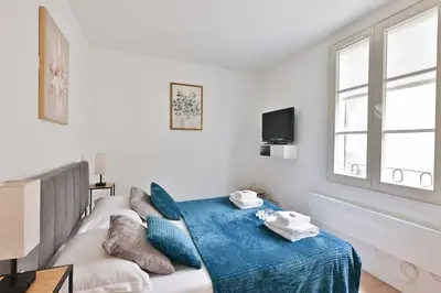 Un ou plusieurs lits dans un hébergement de l'établissement Charming apartment in the heart of the Marais