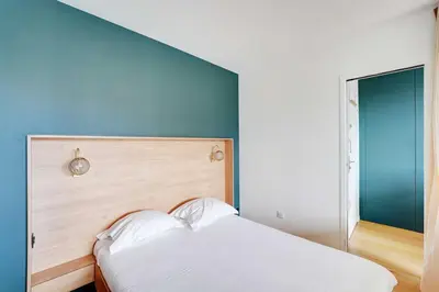 Un ou plusieurs lits dans un hébergement de l'établissement Charming apartment - 1BR- 2P- Nation