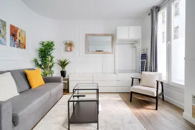 Coin salon dans l'établissement Cozy Apartment for 4 people Montorgueil-Grands Boulevards