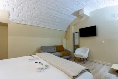 Télévision ou salle de divertissement dans l'établissement Designer Appartement - 6p