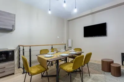Télévision ou salle de divertissement dans l'établissement Designer Appartement - 6p