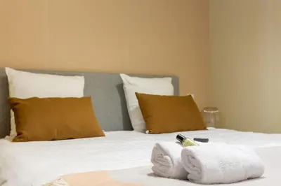 Un ou plusieurs lits dans un hébergement de l'établissement Designer Appartement - 6p