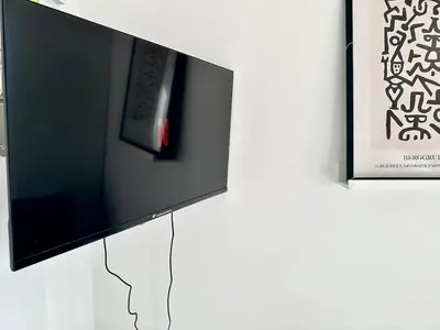 Télévision ou salle de divertissement dans l'établissement 311 Suite Prost - Cosy Apartment Paris Center