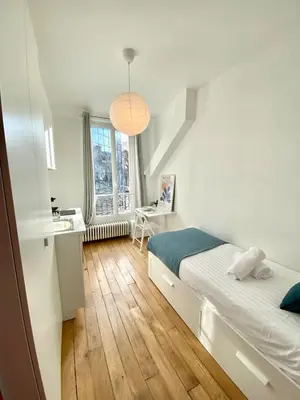 Un ou plusieurs lits dans un hébergement de l'établissement 312 Suite Tour Eiffel -Cosy Apartment Paris Center