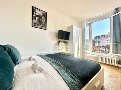 Un ou plusieurs lits dans un hébergement de l'établissement 331 Suite Isabelle Cosy Apartment Paris Center