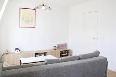 Coin salon dans l'établissement Bright apartment near Paris