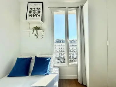 Un ou plusieurs lits dans un hébergement de l'établissement New 354 Suite Paradis- Cosy Apartment Paris Center