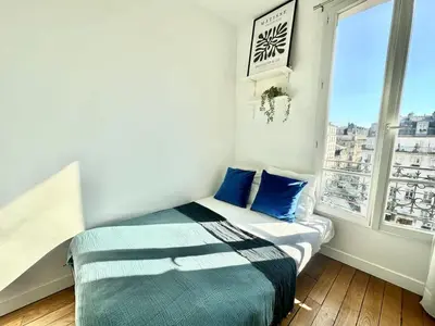 Un ou plusieurs lits dans un hébergement de l'établissement New 354 Suite Paradis- Cosy Apartment Paris Center