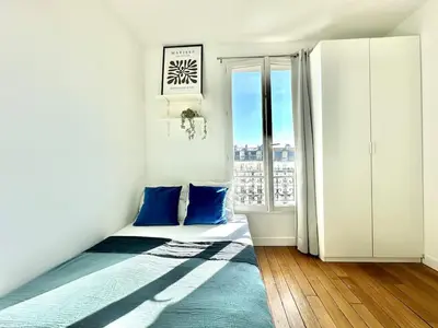 Un ou plusieurs lits dans un hébergement de l'établissement New 354 Suite Paradis- Cosy Apartment Paris Center