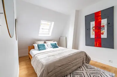 Un ou plusieurs lits dans un hébergement de l'établissement Trocadero Eiffel cozy apartment