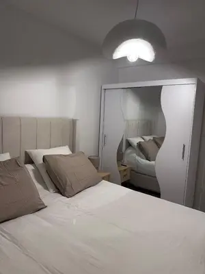 Un ou plusieurs lits dans un hébergement de l'établissement Charmant appartement Boulogne Billancourt