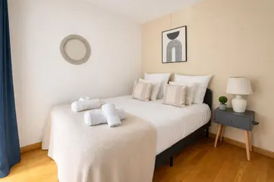 Un ou plusieurs lits dans un hébergement de l'établissement Splendide Appartement à Issy les moulineaux
