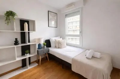 Un ou plusieurs lits dans un hébergement de l'établissement Splendide Appartement à Issy les moulineaux