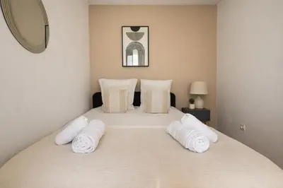 Un ou plusieurs lits dans un hébergement de l'établissement Splendide Appartement à Issy les moulineaux