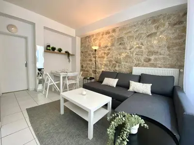 Coin salon dans l'établissement Suite 100 Belmondo Cosy Apartment Paris Center