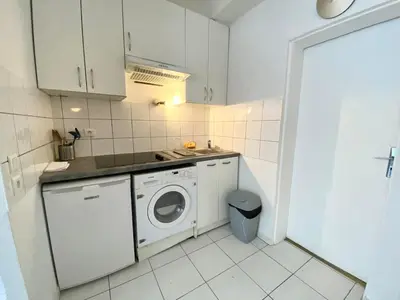 Cuisine ou kitchenette dans l'établissement Suite 100 Belmondo Cosy Apartment Paris Center
