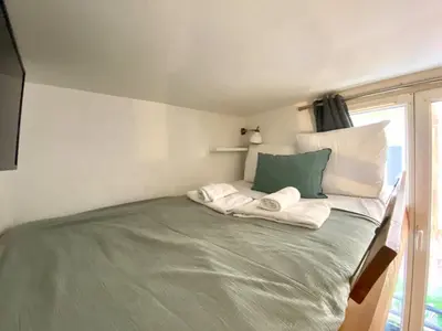 Un ou plusieurs lits dans un hébergement de l'établissement New 116 Suite Deborah - Cosy Apartment Paris Center