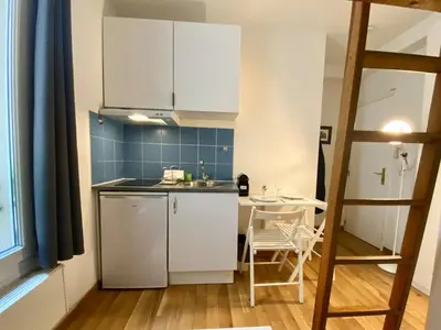 Cuisine ou kitchenette dans l'établissement New 126 Suite Lumiere - Cosy Apartment Paris Center