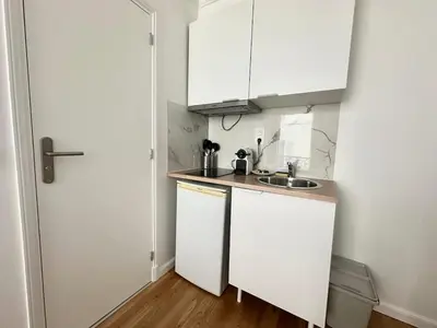 Cuisine ou kitchenette dans l'établissement New 135 Suite Victor - Cosy Apartment Paris Center