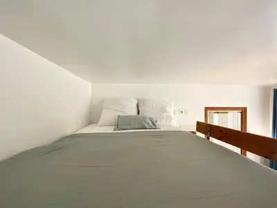 Un ou plusieurs lits dans un hébergement de l'établissement New 137 Suite Yves - Cosy Apartment Paris Center