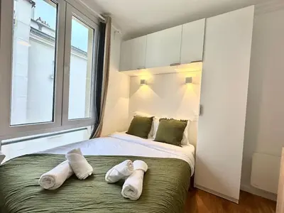 Un ou plusieurs lits dans un hébergement de l'établissement New 141 Suite Marie - Cosy Apartment Paris Center