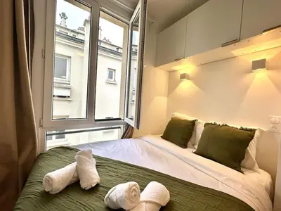 Un ou plusieurs lits dans un hébergement de l'établissement New 141 Suite Marie - Cosy Apartment Paris Center